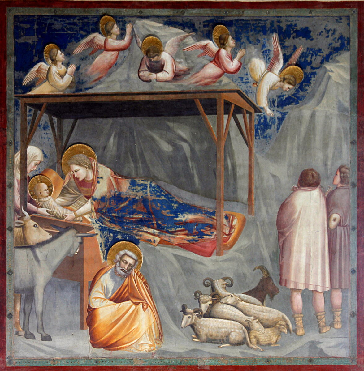 Giotto's fresco of the Nativity, with angels above the stable, Mary with the Child, Joseph seated, and shepherds