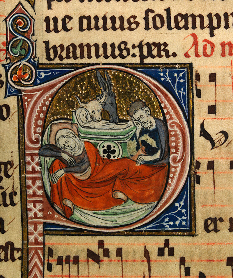 An illuminated initial showing Mary lying down, Joseph seated, and the Christ Child with the ox and ass